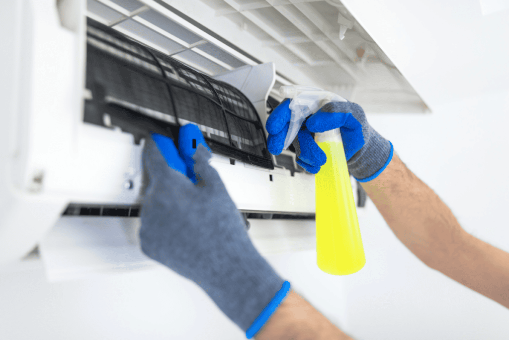 Technician diagnosing an air conditioner that is running without cooling